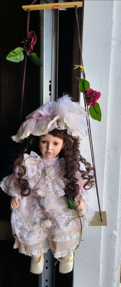Vintage Victorian Style Porcelain doll on a swing