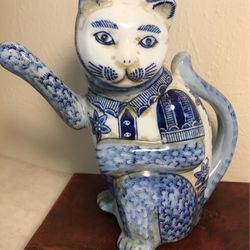 Blue & white porcelain cat with removable hat,  approx 8 1/4”  X  8” .  Mint condition