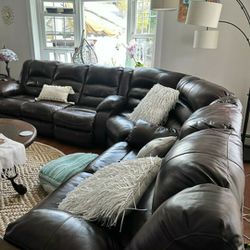 Power reclining leather sectional sofa. Ashley furnitures. 5 years old. 4 recliners
