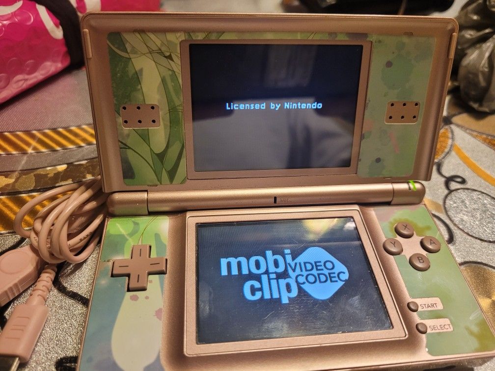 NINTENDO DS LITE PORTABLE CONSOLE WITH CHARGER INCLUDED. A Most NEW