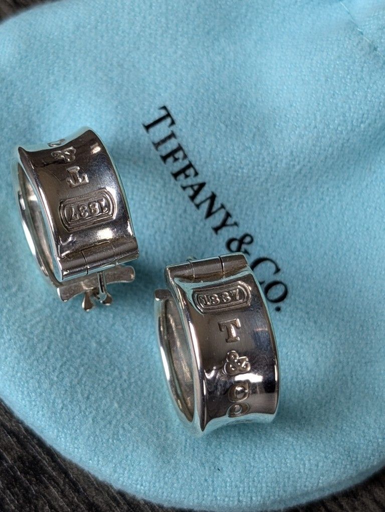 Sterling silver hoop earrings with “Tiffany & Co.