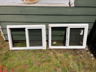 Two 36”x24” white vinyl windows with screens