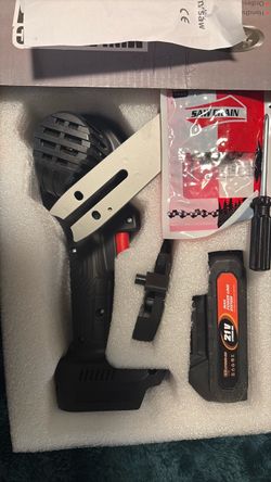 Brand new mini chainsaw with charger