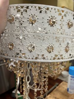 A VERY UNIQUE HANGING ARTISTIC LAMP WITH CRYSTALS HANGING FROM THE LAMP ADDING STYLE AND PIZZAZ ANYWHERE!! 