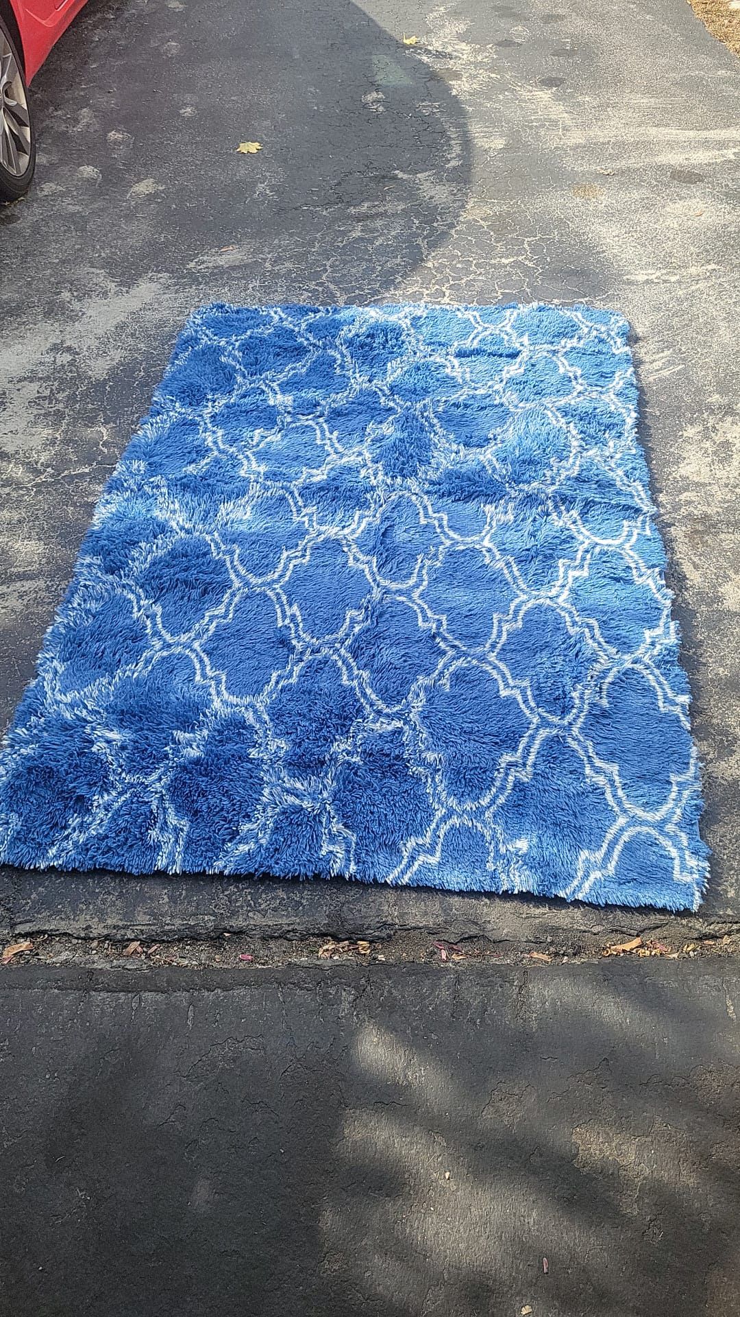 Colorful Area Rug $20 except the circle ones $10 each The small rugs $5 Red and blue patterned area rug. area rug with blue abstract design. (1) Any
