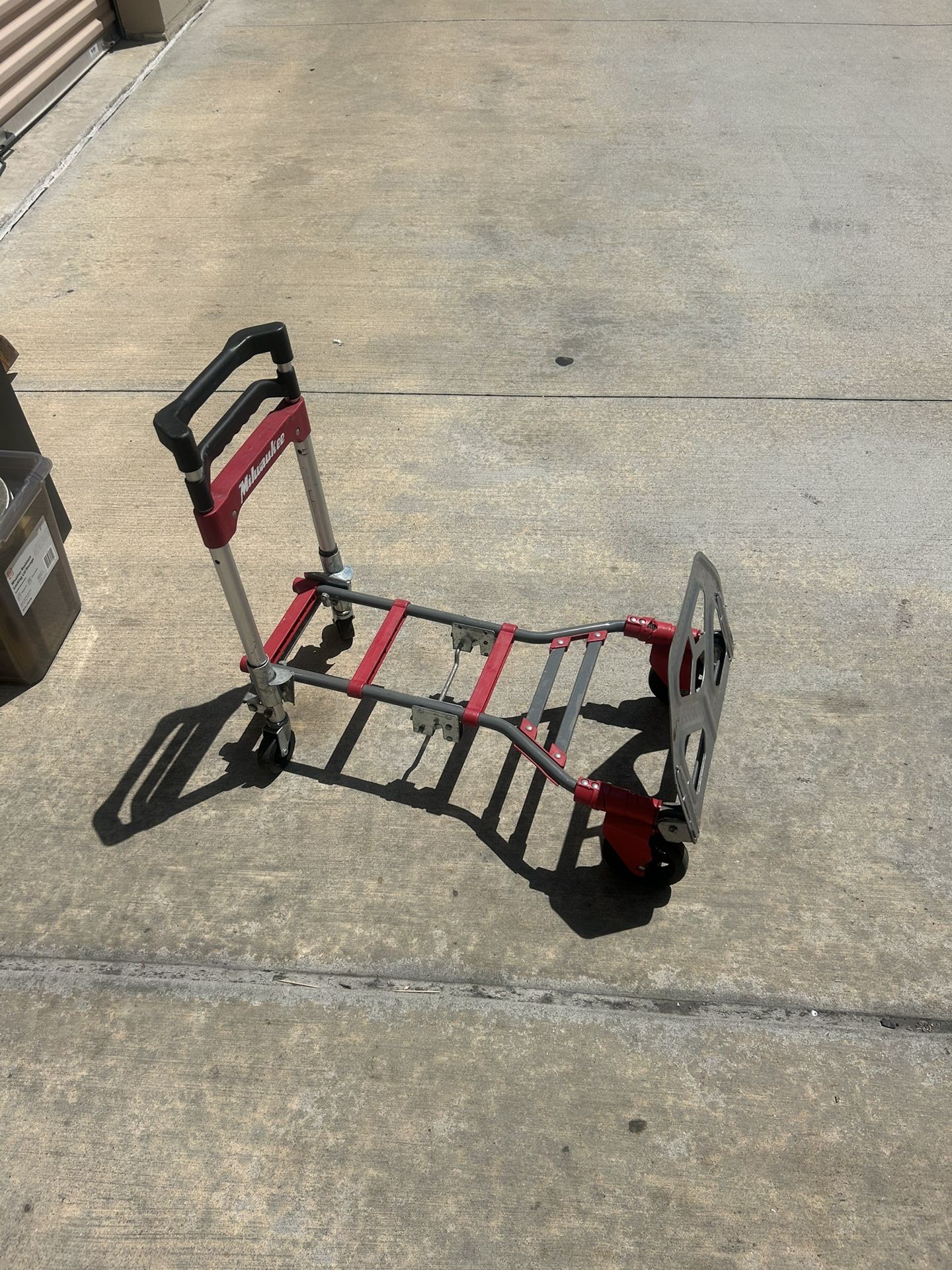 Milwaukee Foldup Truck/Dolly The feet where the rollers are do not seem to easily open or one is stuck