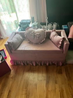 Pink sofa/ottoman with heart pillow