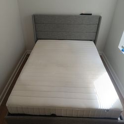 IKEA Mattress and Gray Upholstered Bed Frame