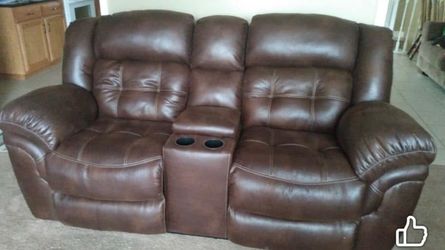 Brown, leather reclining loveseat