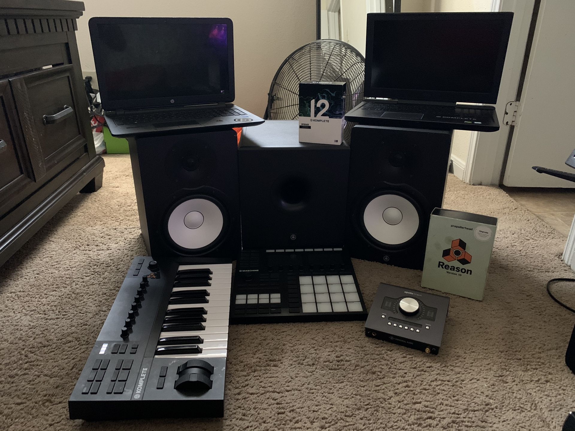Yamaha HS8 Monitors with Subwoofer, Native Instruments A25 keyboard, Apollo Twin quad, machine mk3 with Komplete 12 plug ins, and reason 10
