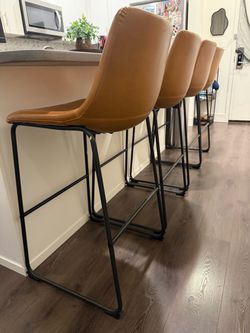 4 brown bar stools