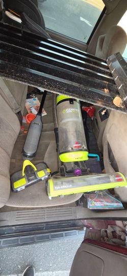 Two Bissell pet vacuum and 1 shark mop vacuum