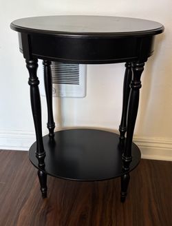 BLACK OVAL PLANT STAND TABLE