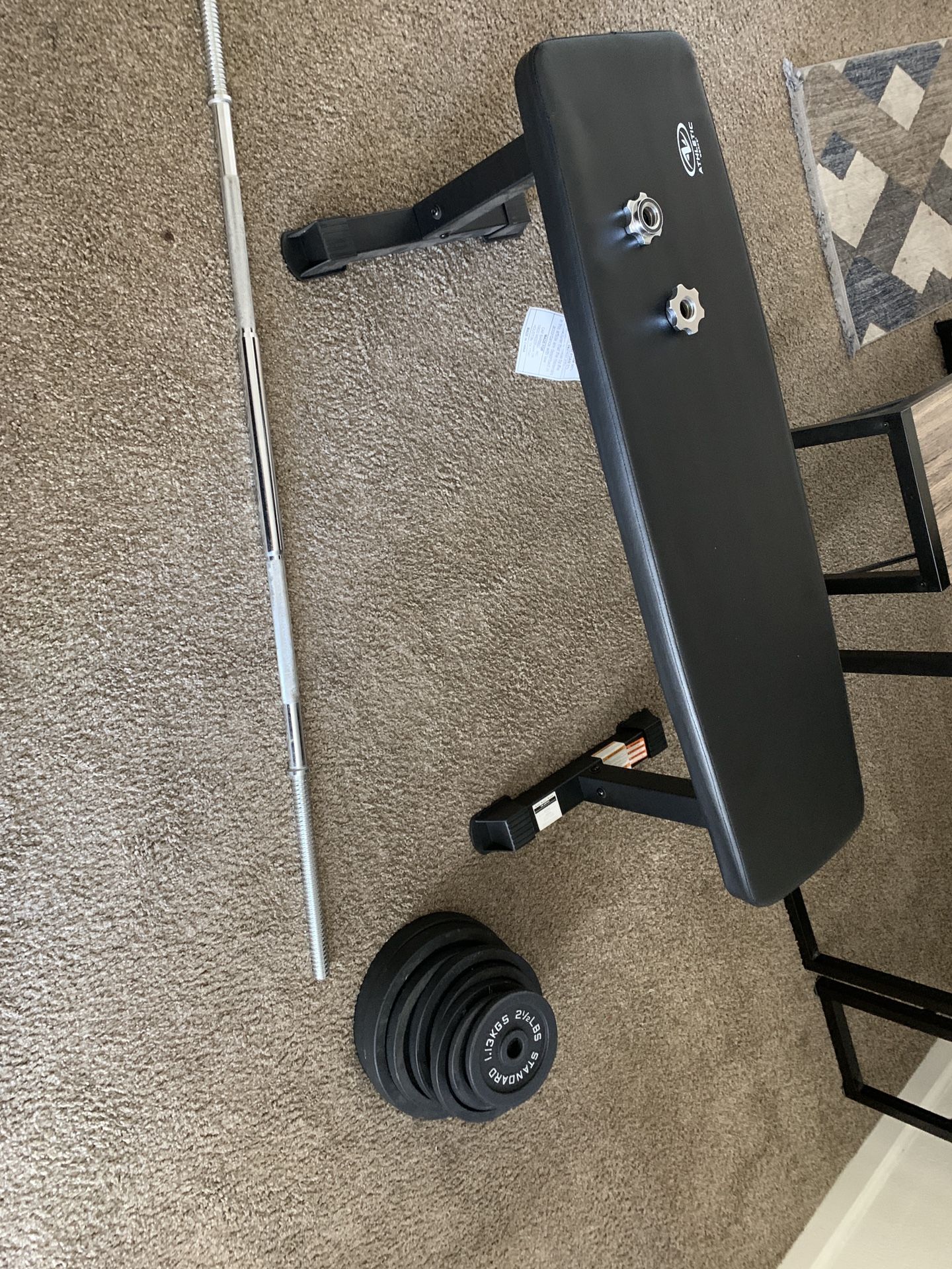 Exercise Barbell With Weights And A Weight Bench