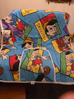 Disney Pinocchio reversible Cuddle Quilt featuring Figaro the cat.