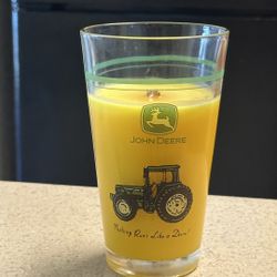 Yellow Wood Wick Candle In a John Deere Nothing Runs Like A Deer Container. 