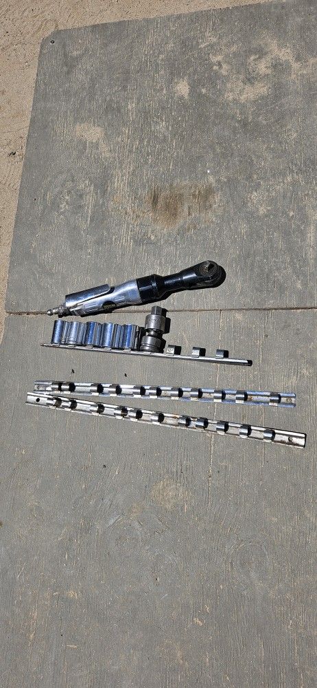 Air Wrench With Some Sockets And Socket Organizers