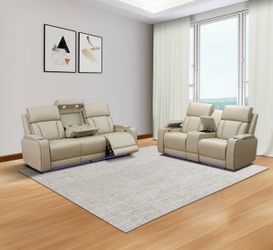 Beige leather all power electric fully reclining couch and love seat