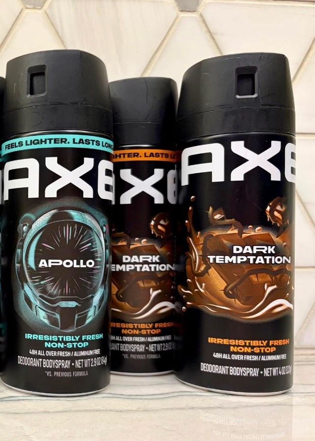 set of three Axe Deodorant Bodysprays. One is Apollo scent, 2.9 oz. Two are Dark Temptation scent, one is 2.9 oz and other is 4 oz.