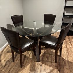48” Round 4 Seat Glass Dining Table With Brown Leather Chairs