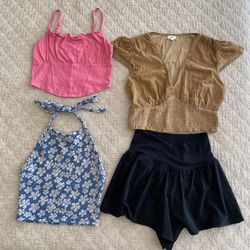 Three Women’s Tops With A Pair Of Shorts