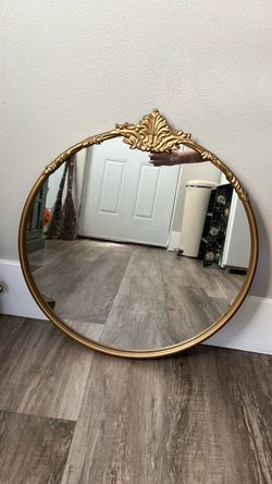gold round mirror