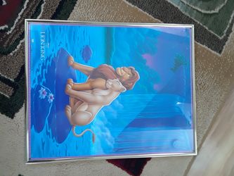 Lion King poster under glass.