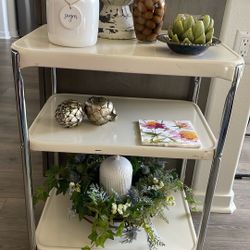 Three tiered vintage cart on wheels