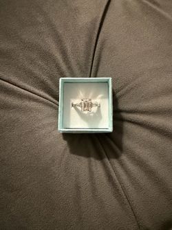 3 stone emerald cut ring