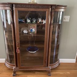 Oak Serpentine Glass China Cabinet with lion heads and claw feet