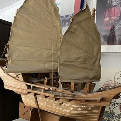 Wooden model ship with sails