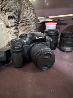 LUMIX GH4 camera with battery and 3 lenses