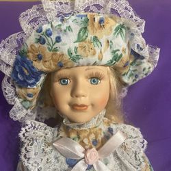 Fine Porcelain Doll in Matching Floral Outfit