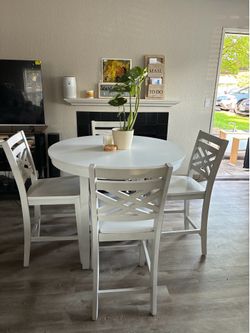 White table and four chairs