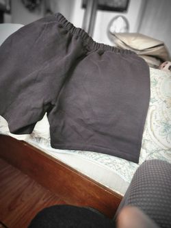 Essentrial fear of God black shorts sz. Lg white logos