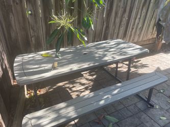 Picnic table, stand and umbrella