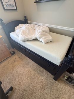 Pottery Barn trundle bed with 2 twin mattresses.