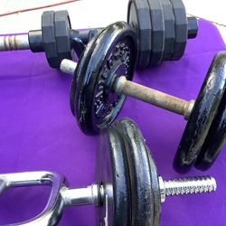 2 SETS OF DUMBBELLS AND 2 SETS OF BARBELLS.    TOTAL WEIGHTS 150 LBs +.  