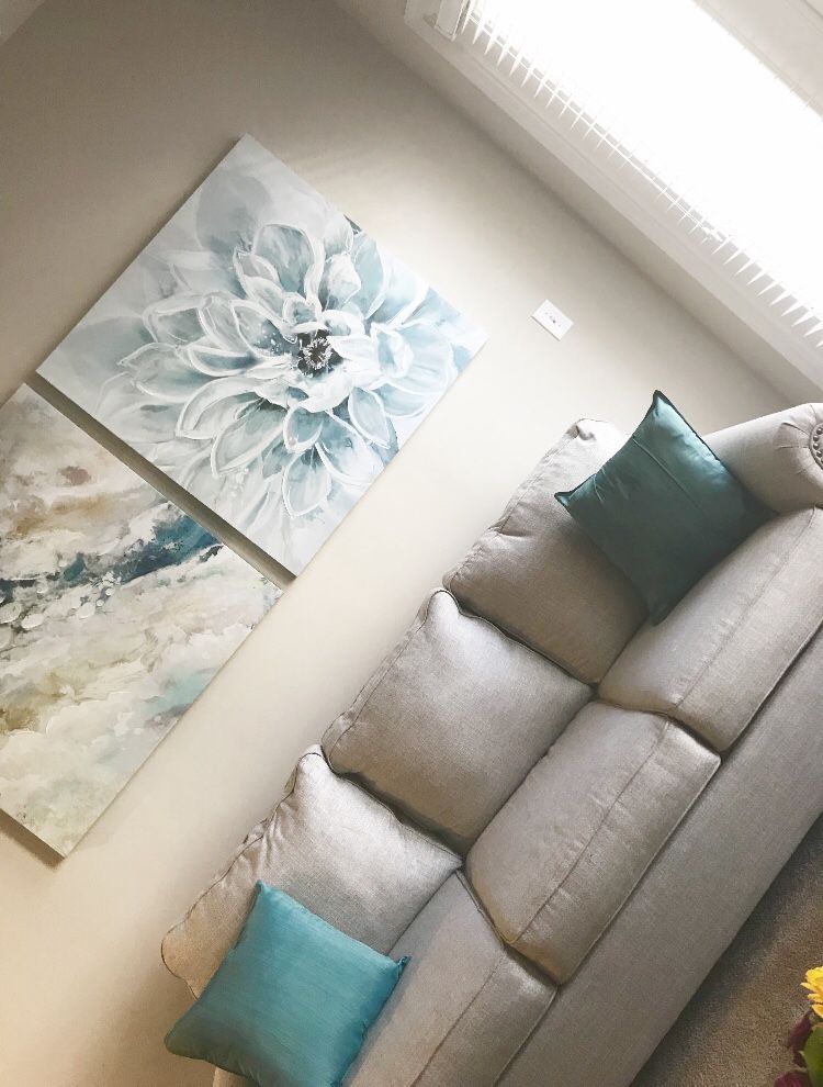 Couch, pillows, and 2 pictures
