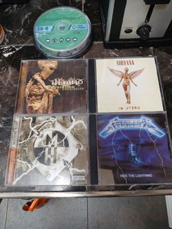 4 immaculate Condition metal/ Rock CDs with 10 pack blank CDs