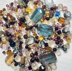 Versatile multicolor glass bead mix for jewelry making. Includes prominent teal-blue, amber, pink and clear beads for vibrant designs. High-shine face