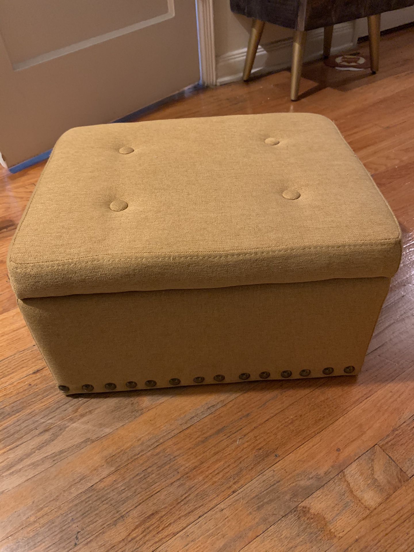 Small Mustard Yellow Storage Ottoman with Brass Accent Buttons at Bottom