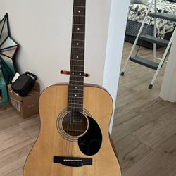 Guitar With Stand And Extra Strings