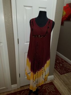 Tie dyed sundress or silver shirt. Size large