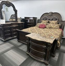 Stanley Cherry Brown Upholstered Sleigh Bedroom Set