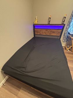 New full size bed frame and mattress, led with extra storage.