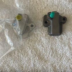 Time and chain tensioner