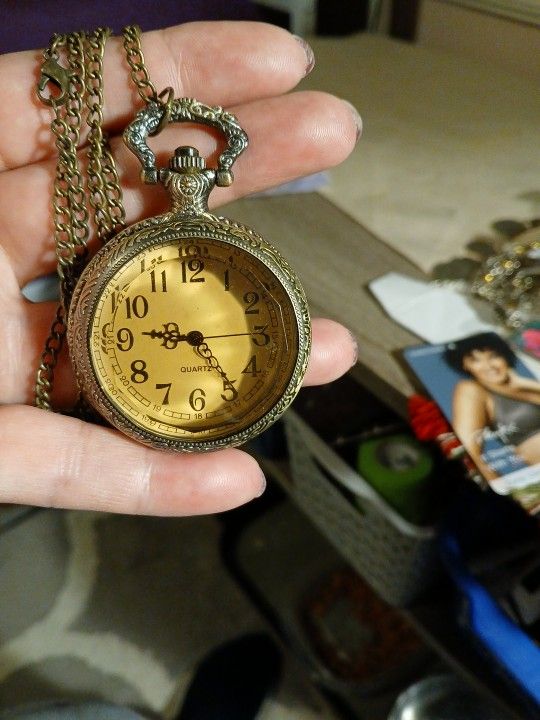 The antique pocket clock is working.