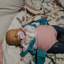 Newborn baby doll with carrier