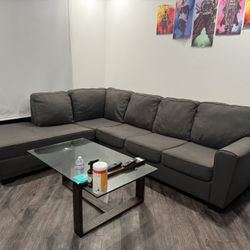 Modern Gray Sectional + Glass Coffee Table – Great Condition